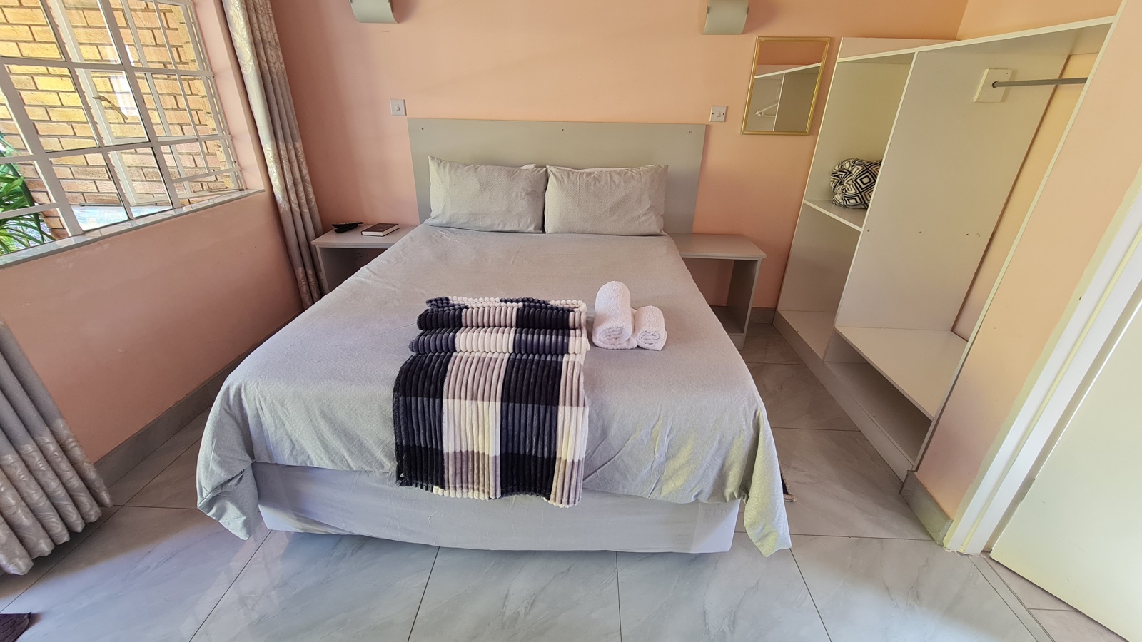 Deluxe queen suite bedroom at Lynn's Guesthouse